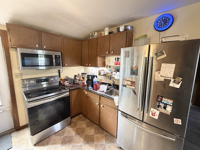 403 Mcquillan Ave, Lead, SD 57754 - kitchen featuring stainless steel appliances, dark countertops, and a sink