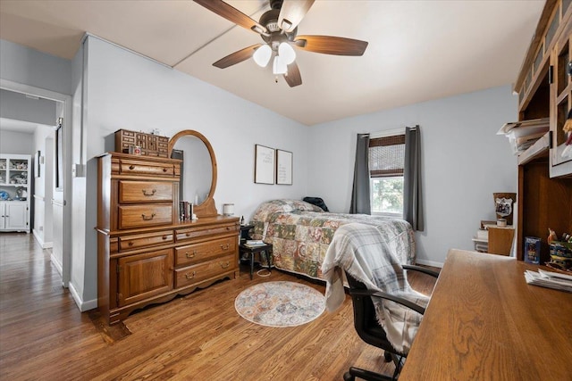 824 W Mcclellan St, Lead, SD 57754 - bedroom with wood finished floors and a ceiling fan