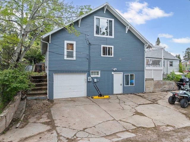 824 W Mcclellan St, Lead, SD 57754 - back of property featuring a garage and concrete driveway