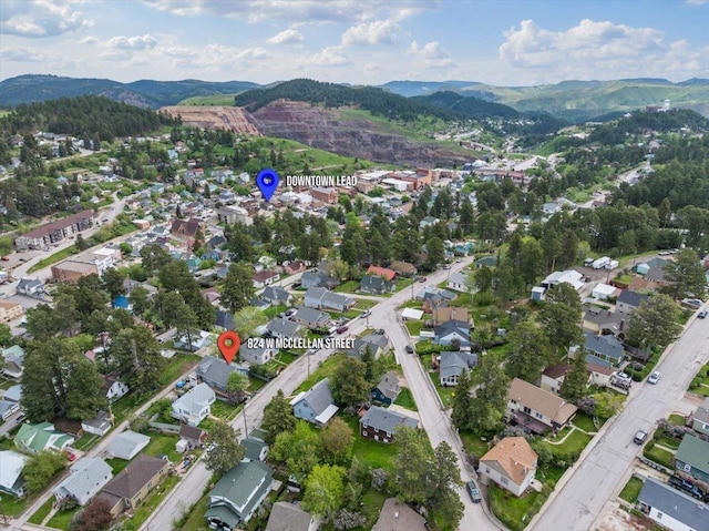 824 W Mcclellan St, Lead, SD 57754 - aerial view of property and surrounding area with mountains and nearby suburban area