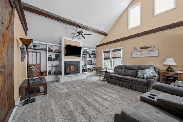 824 W Mcclellan St, Lead, SD 57754 - carpeted living room with high vaulted ceiling, a tiled fireplace, a ceiling fan, and beam ceiling