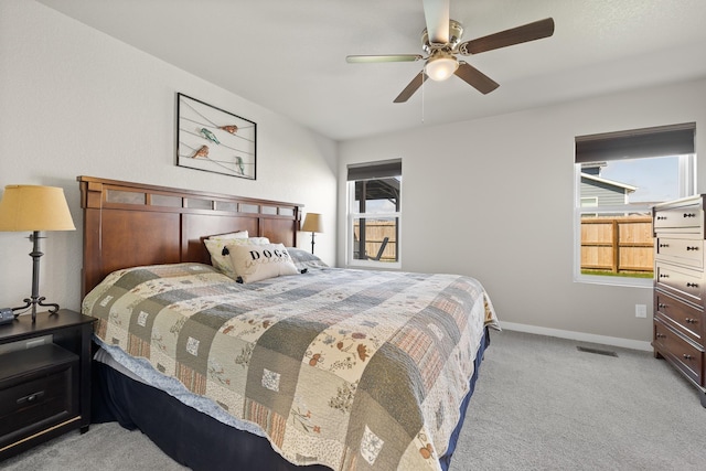 503 Aaron Ct, Rapid City, SD 57703 - carpeted bedroom with baseboards and ceiling fan