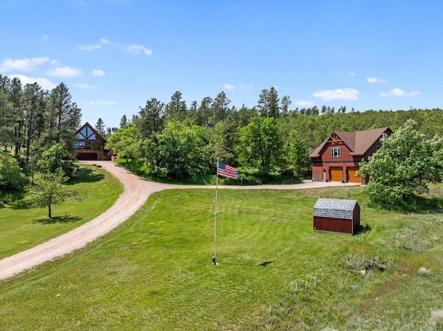 15377 Ridgeview Trl, Piedmont, SD 57783 - view of grassy yard featuring driveway and a garage