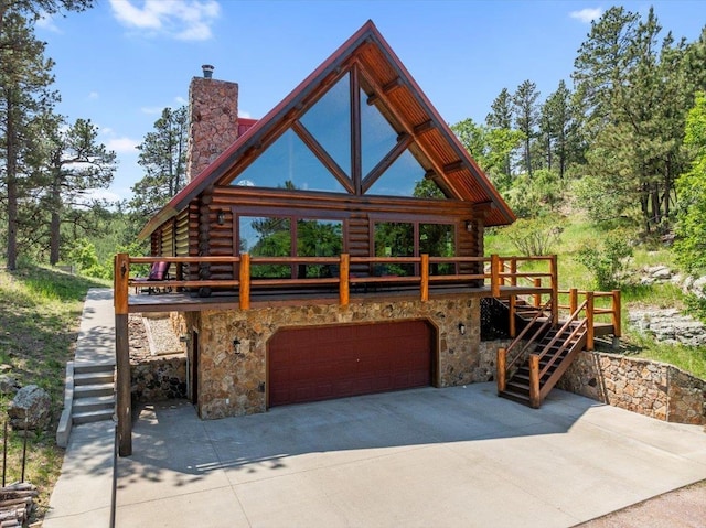 15377 Ridgeview Trl, Piedmont, SD 57783 - view of front of house featuring stairway, log siding, stone siding, and a chimney