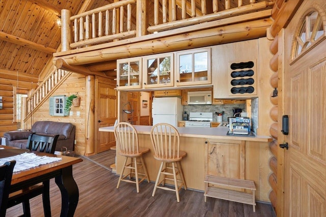 15377 Ridgeview Trl, Piedmont, SD 57783 - kitchen featuring white appliances, high vaulted ceiling, rustic walls, glass insert cabinets, and a peninsula
