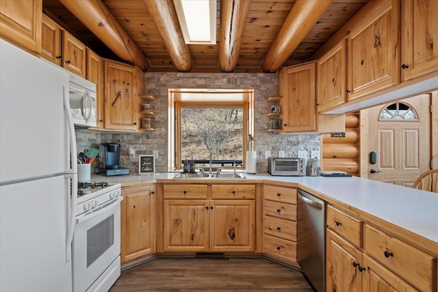 15377 Ridgeview Trl, Piedmont, SD 57783 - kitchen with white appliances, a sink, plenty of natural light, wooden ceiling with exposed beams, and light countertops