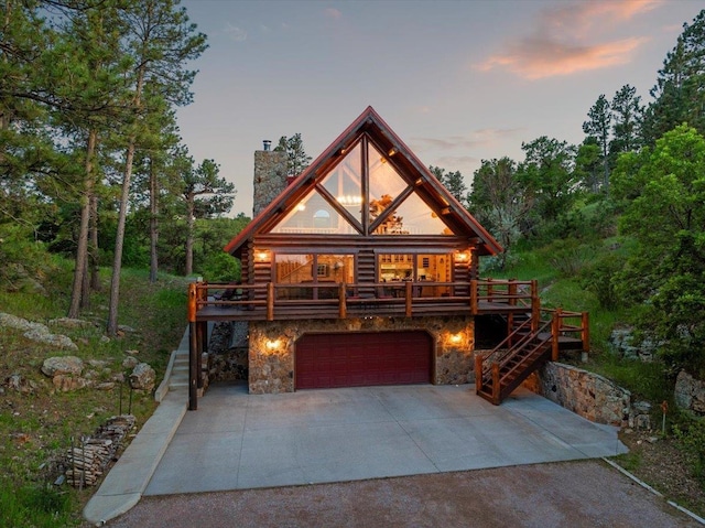 15377 Ridgeview Trl, Piedmont, SD 57783 - log cabin featuring stairway, a chimney, stone siding, and driveway