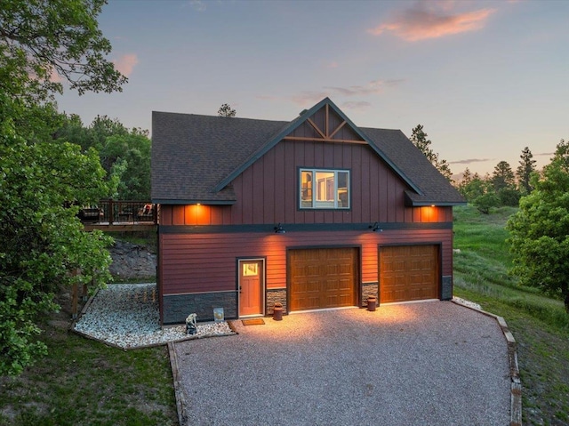 15377 Ridgeview Trl, Piedmont, SD 57783 - view of front of house featuring stone siding, board and batten siding, driveway, and roof with shingles