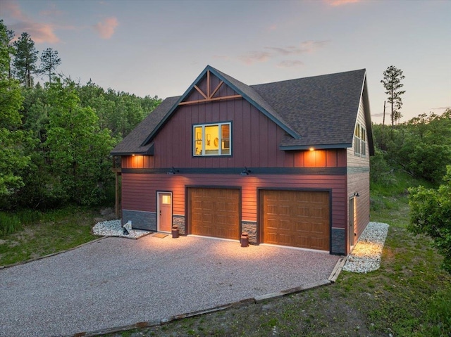 15377 Ridgeview Trl, Piedmont, SD 57783 - view of front of house with gravel driveway, a shingled roof, stone siding, and board and batten siding