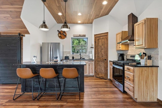 15377 Ridgeview Trl, Piedmont, SD 57783 - kitchen with appliances with stainless steel finishes, a kitchen breakfast bar, lofted ceiling, dark countertops, and a sink