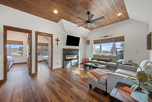 15377 Ridgeview Trl, Piedmont, SD 57783 - living area featuring vaulted ceiling, a ceiling fan, dark wood finished floors, a glass covered fireplace, and wood ceiling