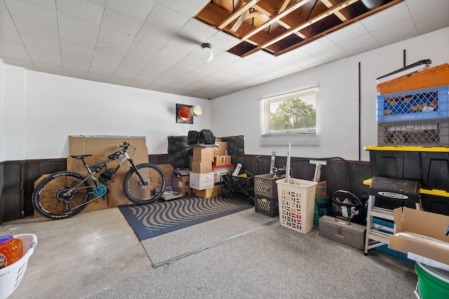 4902 Baldwin St, Rapid City, SD 57702 - misc room featuring wainscoting, concrete flooring, and wood walls