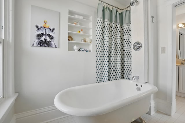1015 W W Boulevard, St, Rapid City, SD 57701 - bathroom featuring a soaking tub, tile patterned floors, vanity, and a shower with curtain