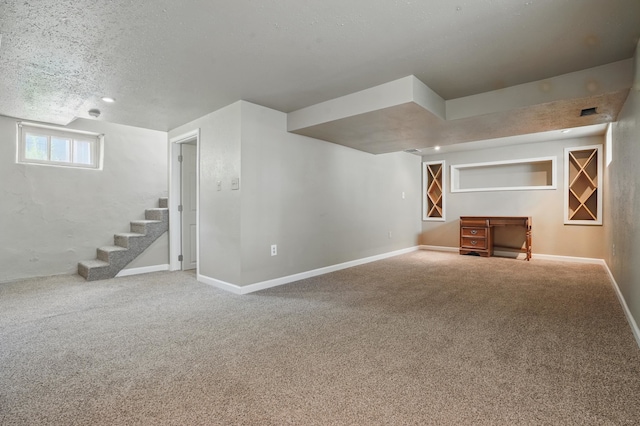 1015 W W Boulevard, St, Rapid City, SD 57701 - basement with carpet, stairs, and a textured ceiling