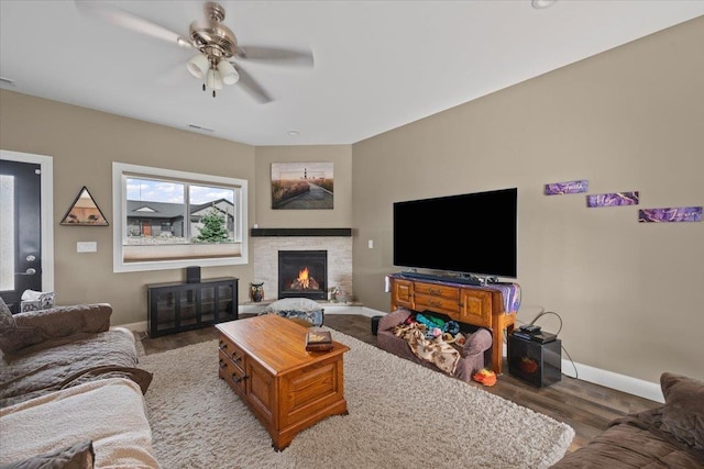 3781 W Beartooth Loop, Spearfish, SD 57783 - living room featuring wood finished floors, a ceiling fan, and a stone fireplace