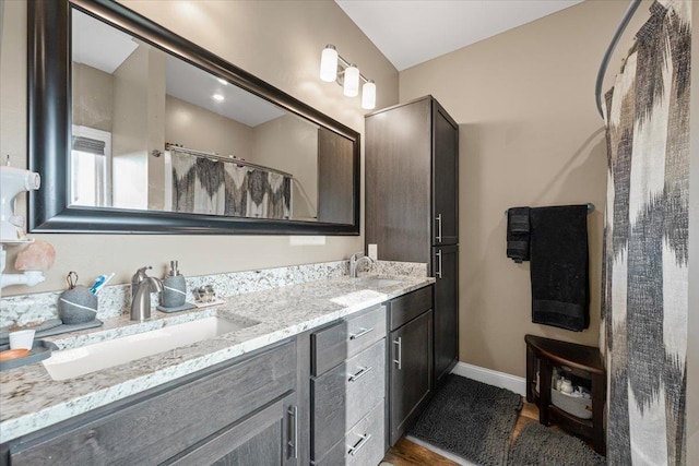 3781 W Beartooth Loop, Spearfish, SD 57783 - bathroom with double vanity and wood finished floors