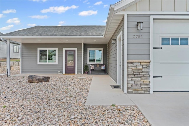 3781 W Beartooth Loop, Spearfish, SD 57783 - property entrance with a shingled roof, stone siding, and board and batten siding