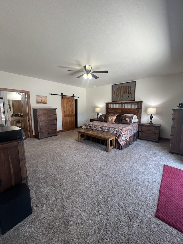 215 Meadowlark Dr, Hot Springs, SD 57747 - bedroom featuring a barn door, carpet flooring, and ceiling fan