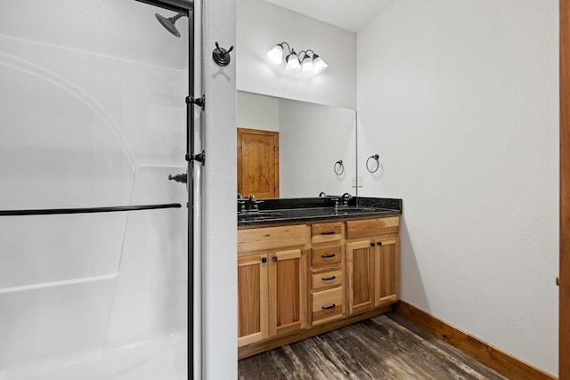 215 Meadowlark Dr, Hot Springs, SD 57747 - full bathroom with wood finished floors, double vanity, and a shower