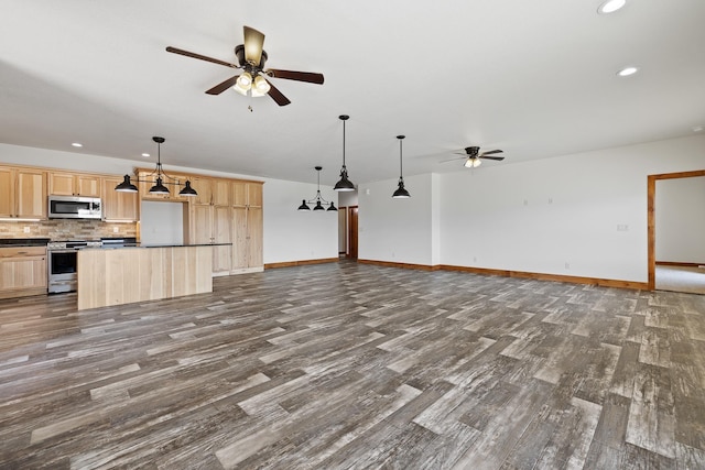 215 Meadowlark Dr, Hot Springs, SD 57747 - unfurnished living room featuring ceiling fan, dark wood-type flooring, and recessed lighting