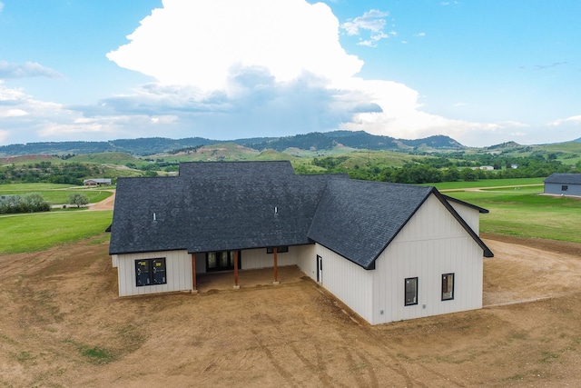 3722 Grand Loop, Spearfish, SD 57783 - view of front of property featuring a mountain view, a shingled roof, and dirt driveway