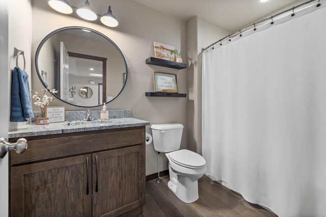 6315 Dunsmore Rd, Rapid City, SD 57702 - bathroom featuring wood finished floors, vanity, and a shower with shower curtain