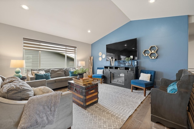 6315 Dunsmore Rd, Rapid City, SD 57702 - living room with vaulted ceiling, recessed lighting, and a glass covered fireplace