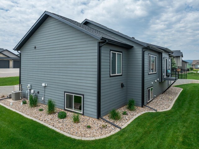 6315 Dunsmore Rd, Rapid City, SD 57702 - view of home's exterior with a lawn and a central air condition unit