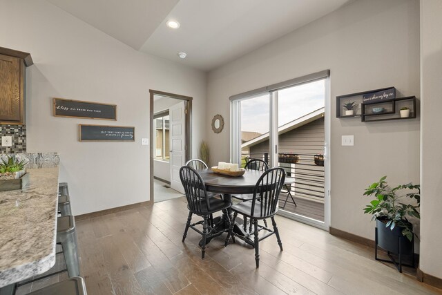6315 Dunsmore Rd, Rapid City, SD 57702 - dining space featuring light wood finished floors and recessed lighting