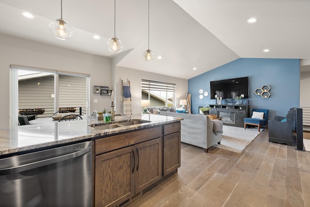 6315 Dunsmore Rd, Rapid City, SD 57702 - kitchen with dishwasher, vaulted ceiling, light wood finished floors, hanging light fixtures, and light stone countertops