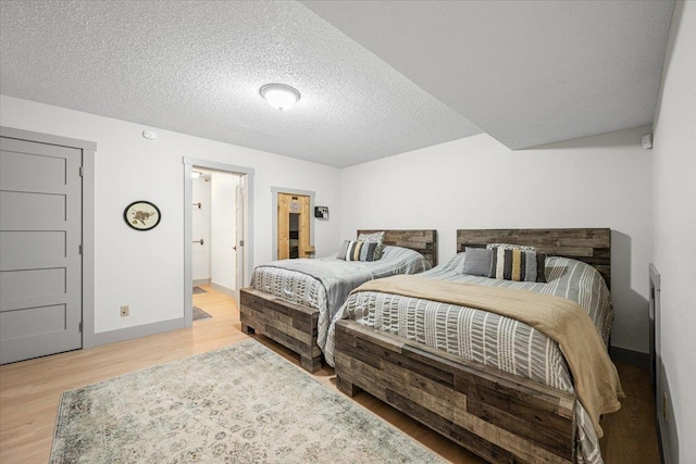 340 Fairway Dr, Spearfish, SD 57783 - bedroom featuring light wood finished floors and a textured ceiling