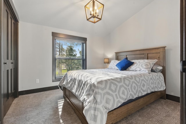 21332 Trailside Rd, Lead, SD 57754 - carpeted bedroom with a chandelier and lofted ceiling