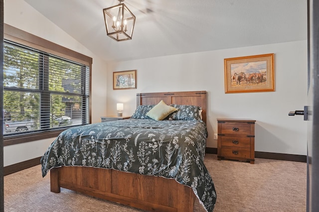 21332 Trailside Rd, Lead, SD 57754 - carpeted bedroom featuring lofted ceiling and a chandelier