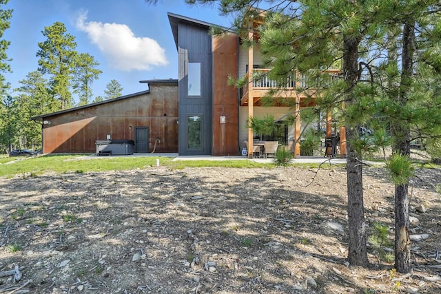 21332 Trailside Rd, Lead, SD 57754 - rear view of property featuring a balcony and a patio area