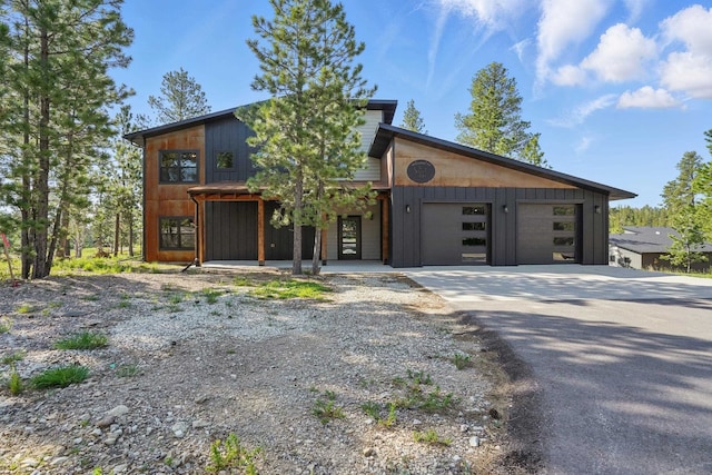 21332 Trailside Rd, Lead, SD 57754 - contemporary house featuring concrete driveway and a garage