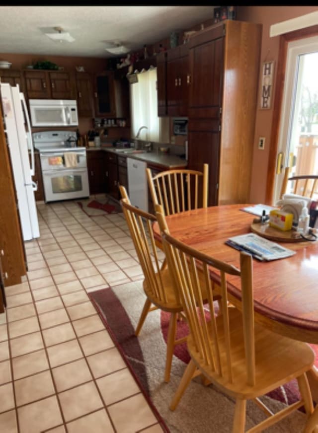 603 E 1st St, Buffalo, SD 57720 - dining room featuring light tile patterned floors