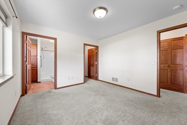 1233 Silverbrook Ln, Spearfish, SD 57783 - unfurnished bedroom with light carpet, connected bathroom, and a spacious closet