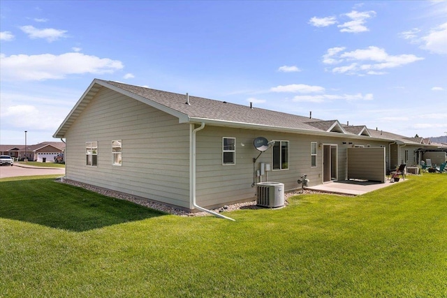 1233 Silverbrook Ln, Spearfish, SD 57783 - back of property with a lawn, a patio, and roof with shingles