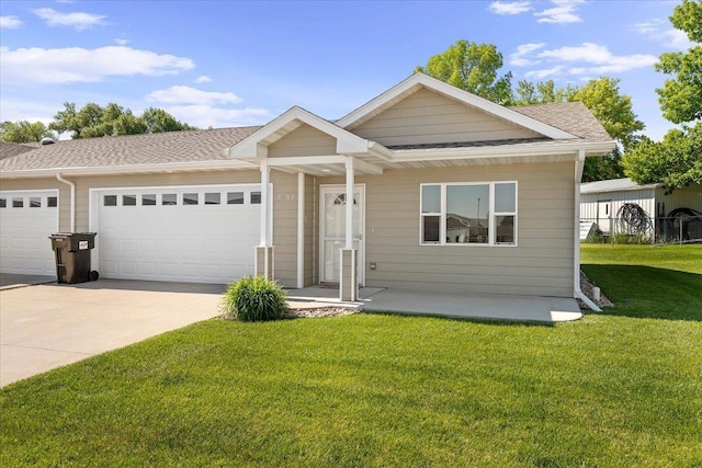 1233 Silverbrook Ln, Spearfish, SD 57783 - view of front of property featuring a garage, driveway, a front lawn, and roof with shingles