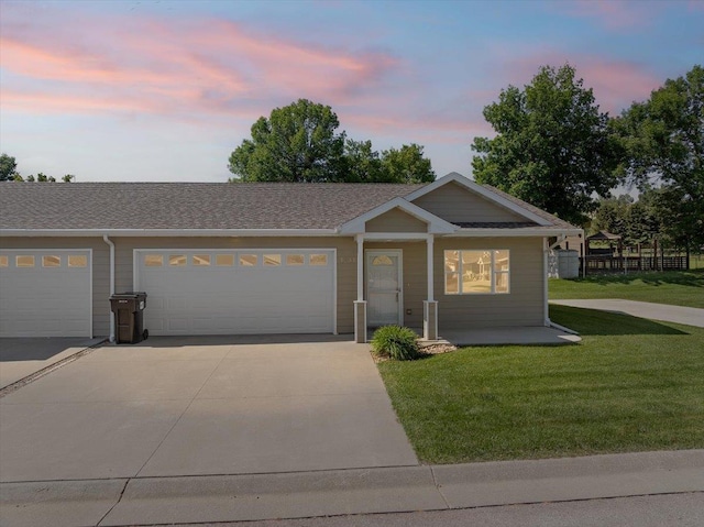 1233 Silverbrook Ln, Spearfish, SD 57783 - ranch-style house featuring driveway, a front lawn, a garage, and a shingled roof