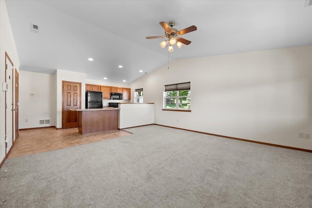 1233 Silverbrook Ln, Spearfish, SD 57783 - unfurnished living room with lofted ceiling, light carpet, a ceiling fan, and recessed lighting