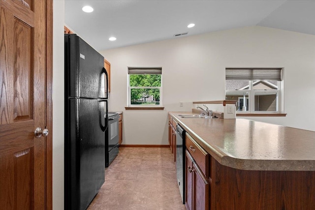1233 Silverbrook Ln, Spearfish, SD 57783 - kitchen featuring black appliances, lofted ceiling, a peninsula, and recessed lighting