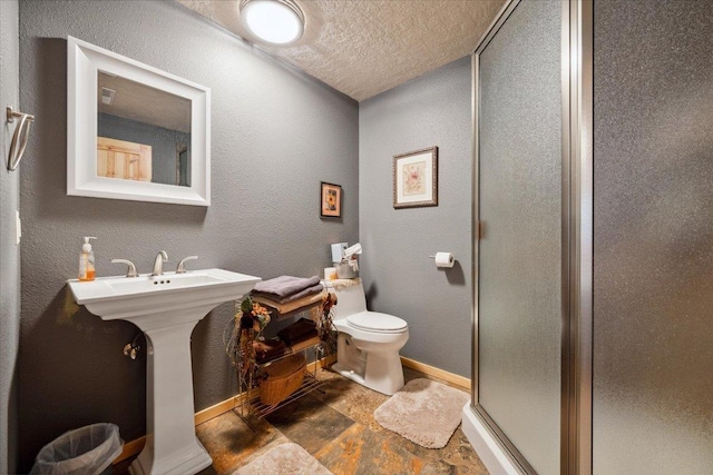 2040 Aster Rd, Spearfish, SD 57783 - full bath with a shower stall, a textured ceiling, and a textured wall