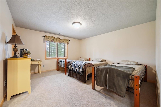 2040 Aster Rd, Spearfish, SD 57783 - bedroom with light carpet and a textured ceiling