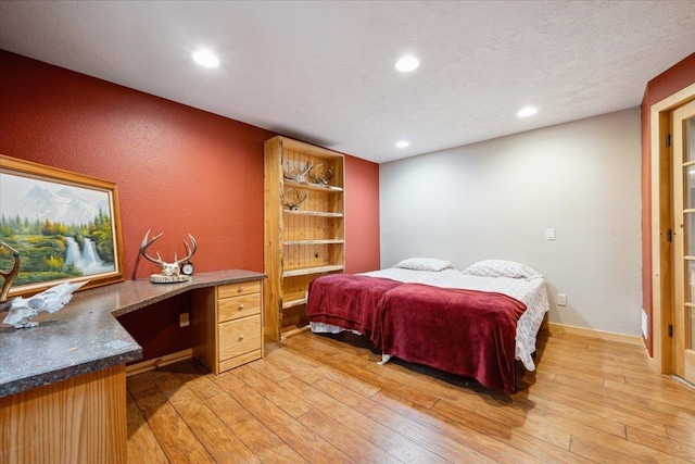 2040 Aster Rd, Spearfish, SD 57783 - bedroom with light wood-style flooring, recessed lighting, and built in study area