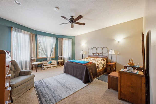 2040 Aster Rd, Spearfish, SD 57783 - bedroom featuring carpet flooring, a textured ceiling, and a ceiling fan