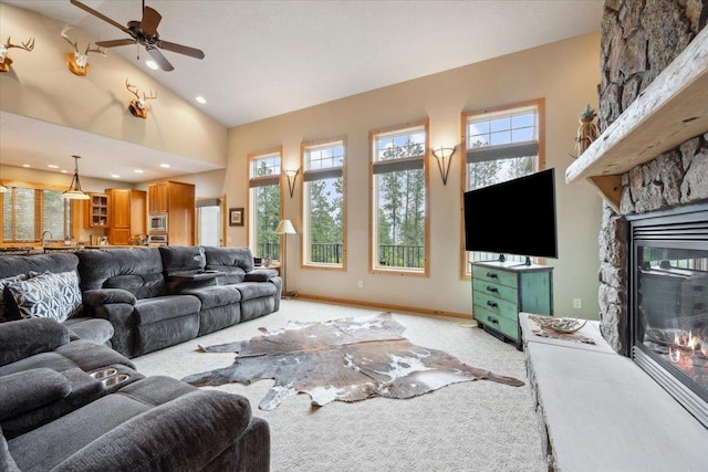 2040 Aster Rd, Spearfish, SD 57783 - living area with a fireplace, light colored carpet, high vaulted ceiling, and a ceiling fan