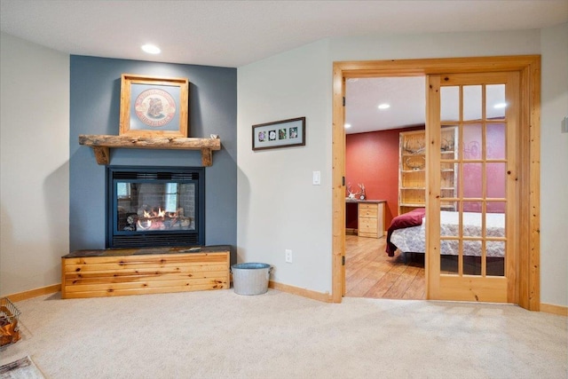 2040 Aster Rd, Spearfish, SD 57783 - living room featuring carpet floors, a multi sided fireplace, and recessed lighting