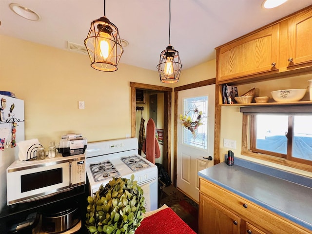 417 Spark St, Lead, SD 57754 - kitchen with white appliances and pendant lighting