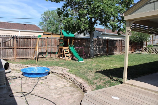 126 E Saint Andrew St, Rapid City, SD 57701 - fenced backyard with a playground and a patio area